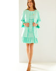 Woman in summer mint dress with ruffle 