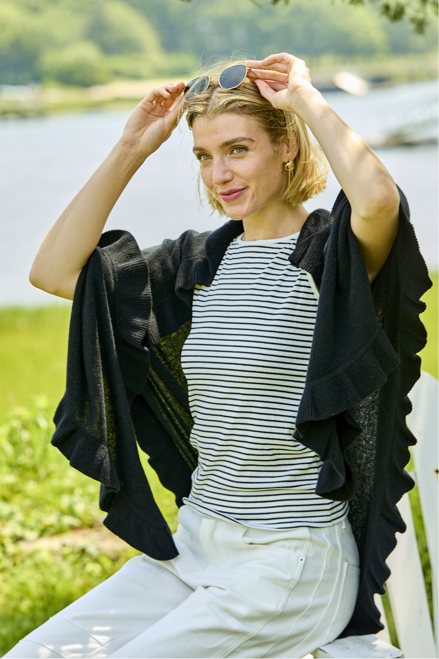 Woman wearing a black ruffle cashmere wrap