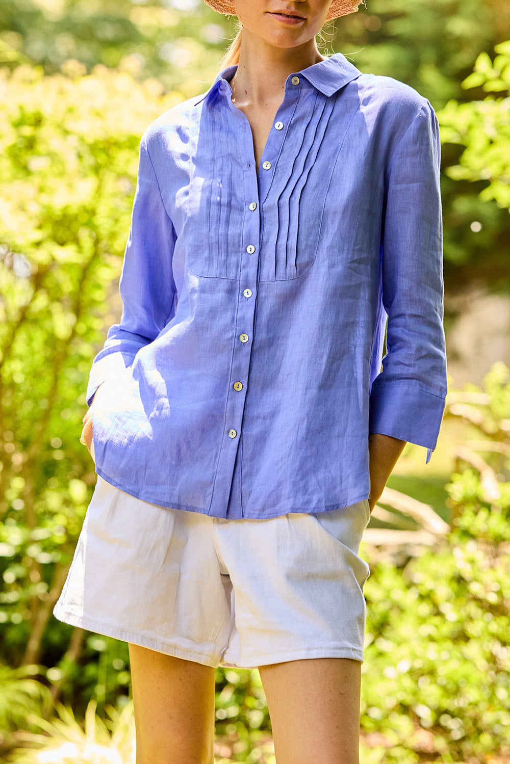 Woman wearing a periwinkle linen blouse
