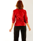 Woman in red button down