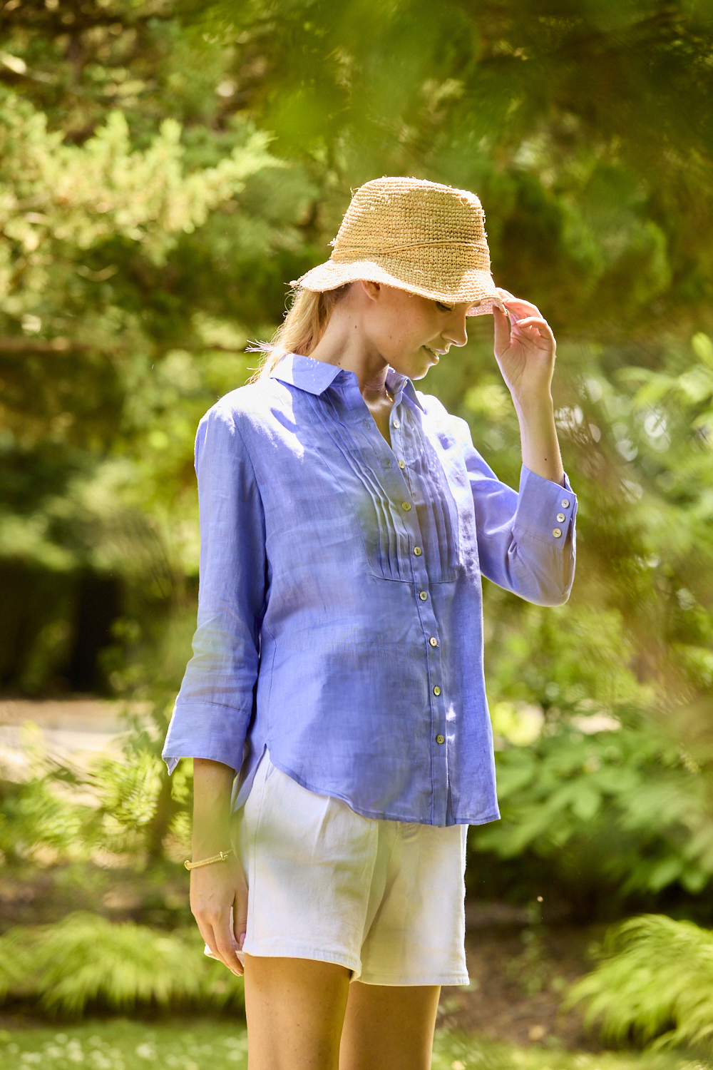 Woman wearing a periwinkle linen blouse