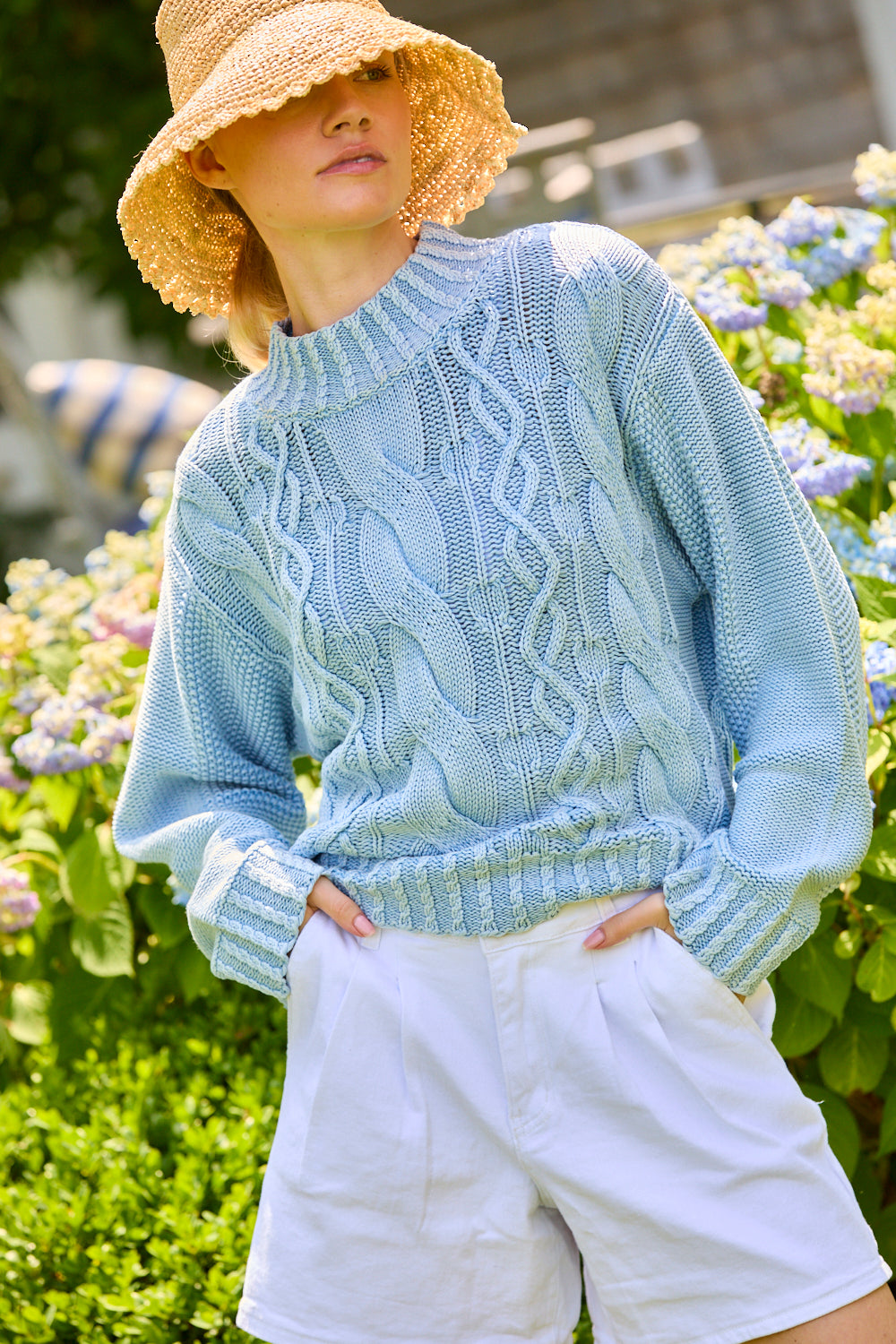 Woman wearing a blue knit sweater
