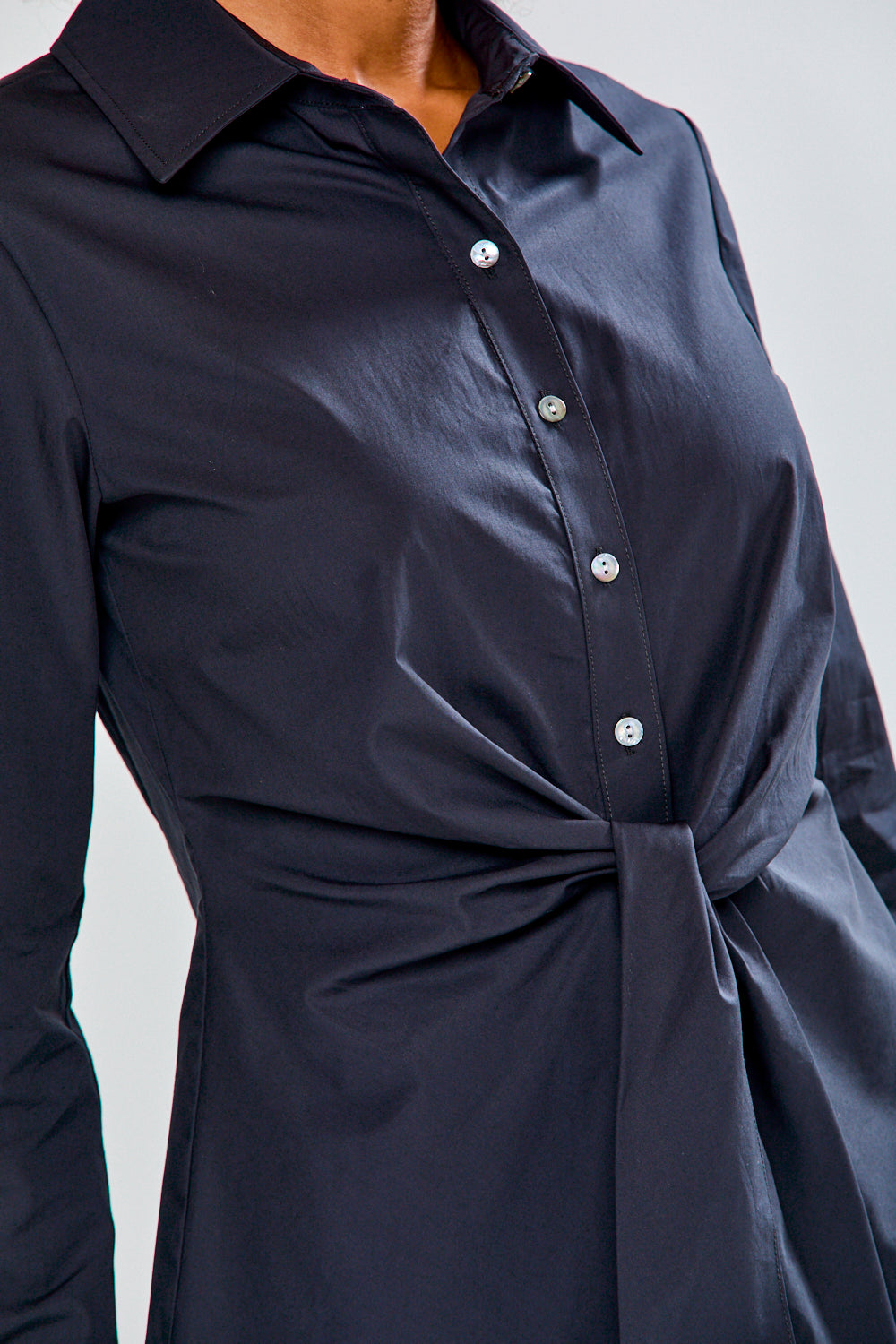 Woman in black button down blouse