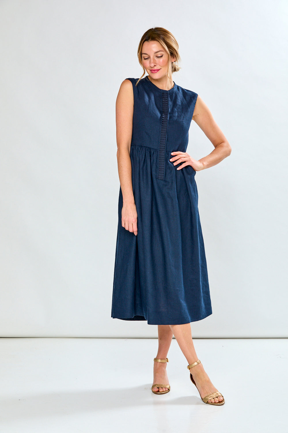 Woman in navy tea length dress