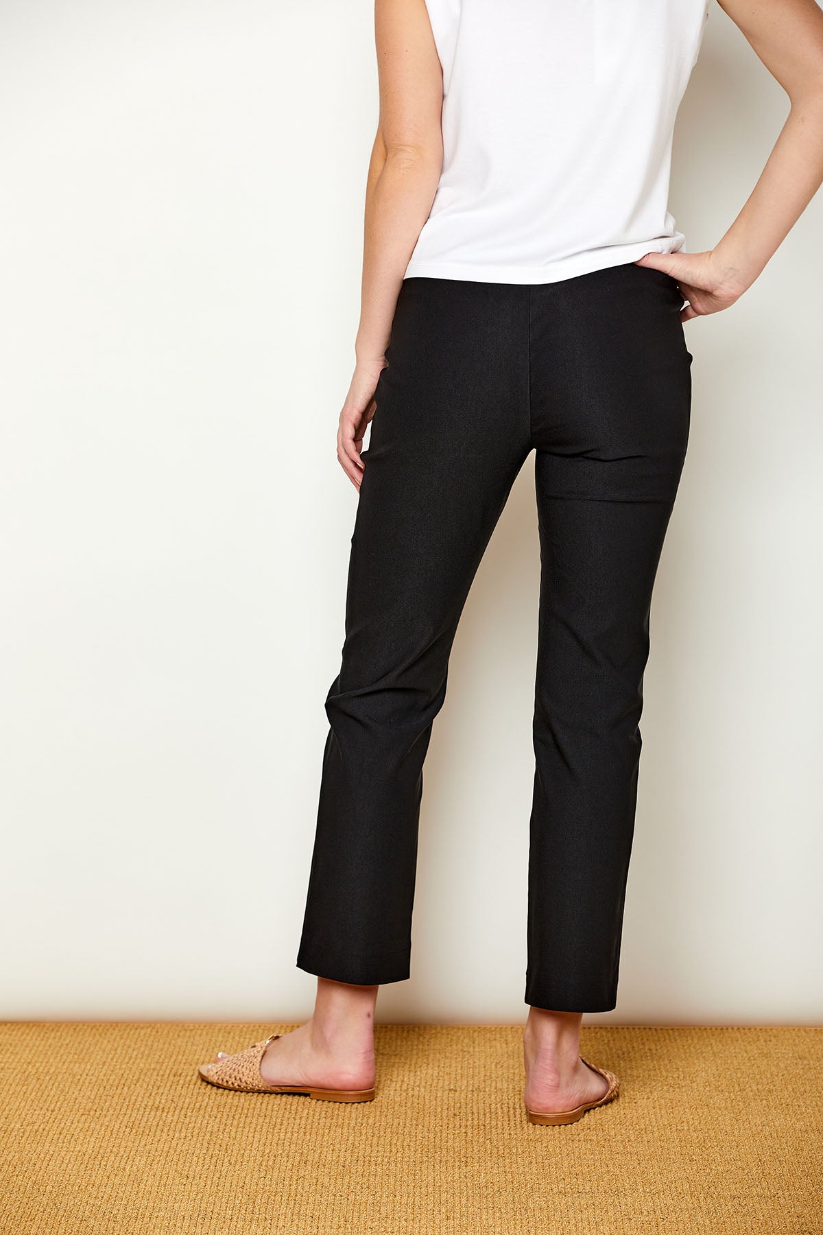 Woman in fitted black colored pants