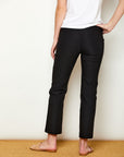 Woman in fitted black colored pants