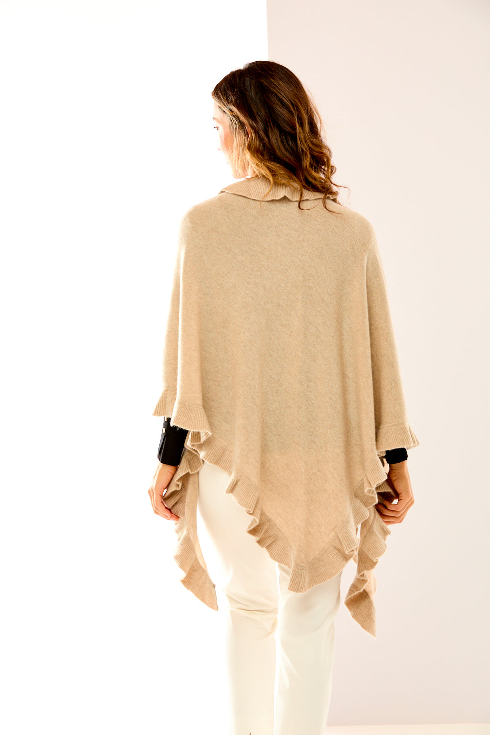 Woman wearing a beige ruffle triangle wrap