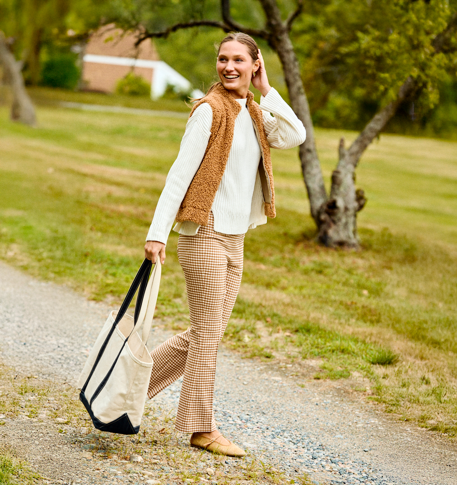 Woman walking with a tote bag