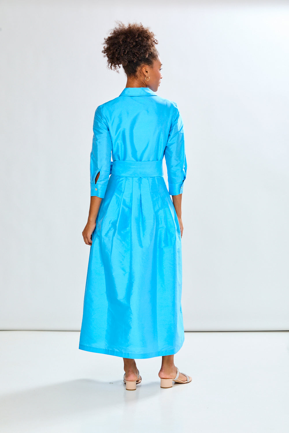 Woman in capri long taffeta dress