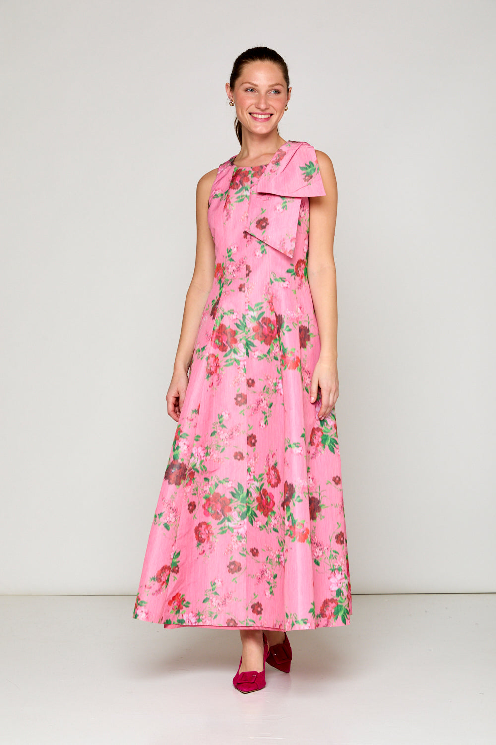 Woman in pink floral dress