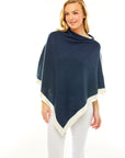 Woman in navy poncho