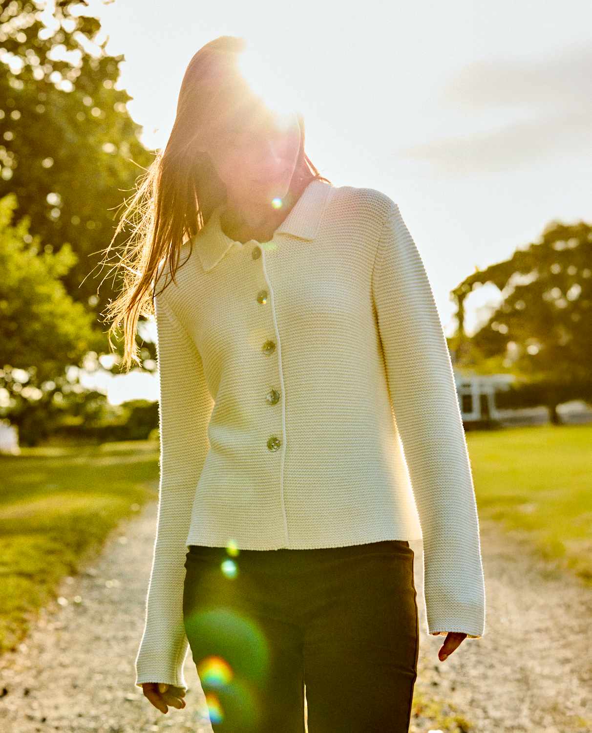 Woman wearing an off white sweater