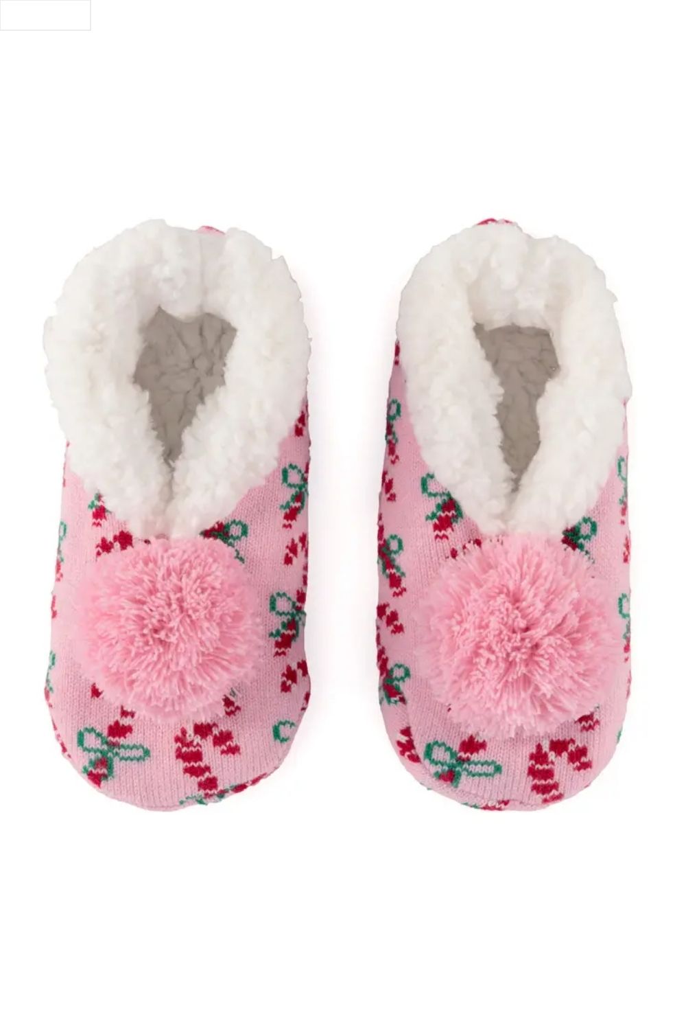 Pair of pink slippers with white fur lining and pom-poms on a white background