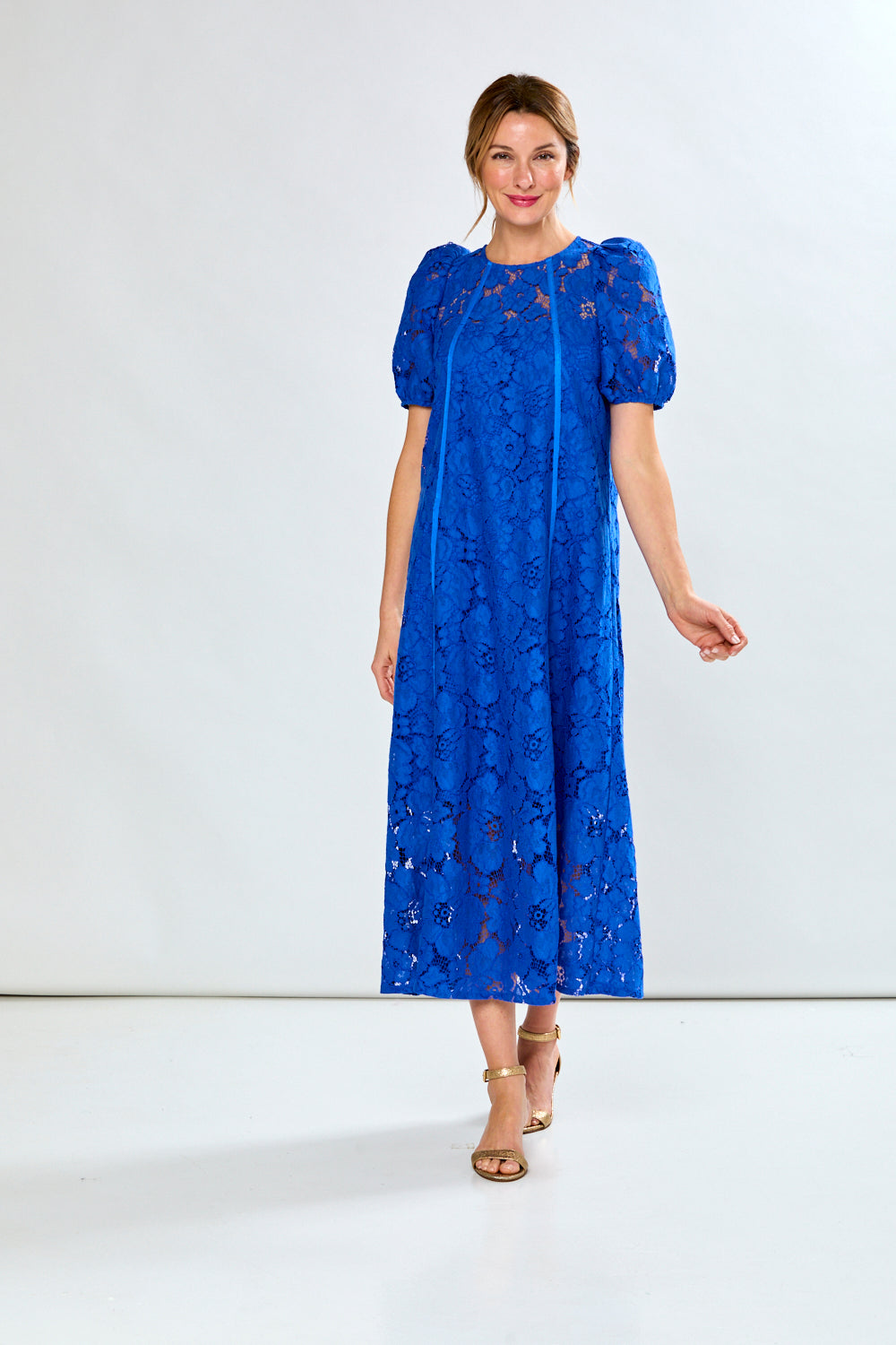 Woman in royal eyelet dress