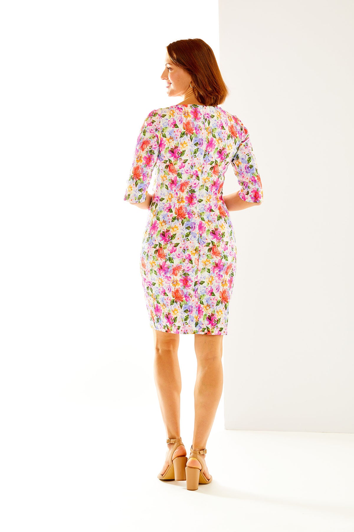 Woman in multi-colored floral dress