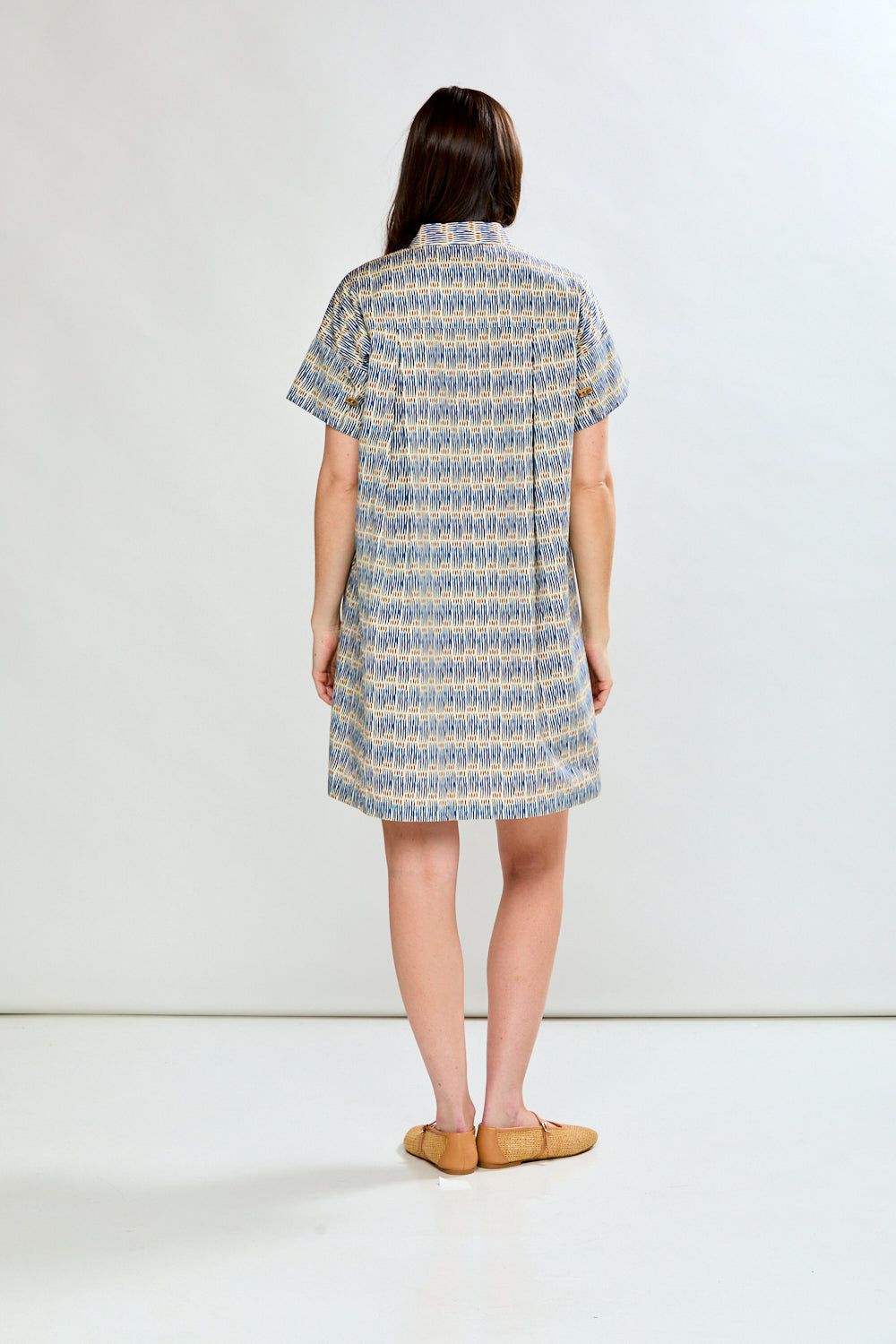 Woman in geo stripe dress