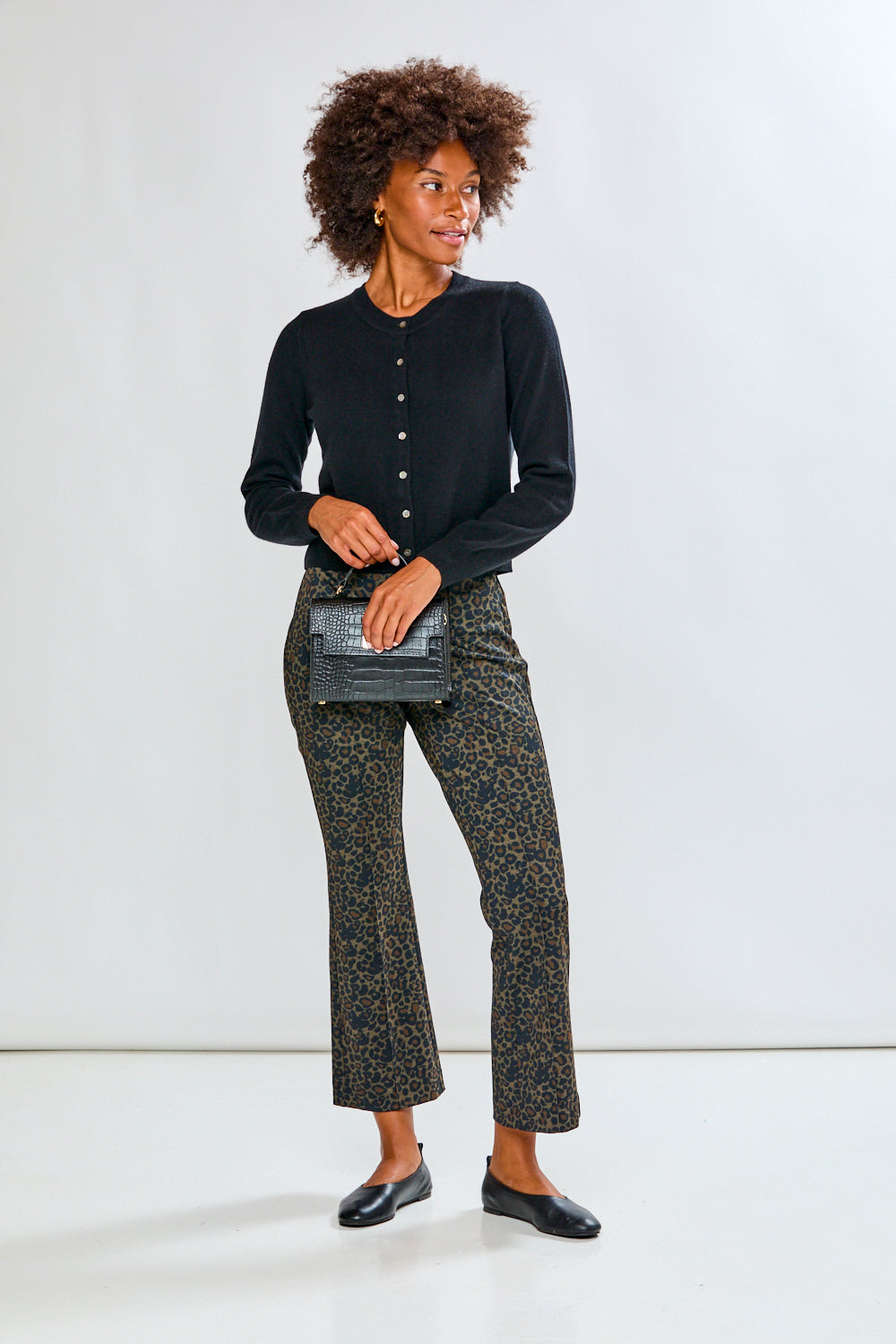 Woman in black cashmere sweater