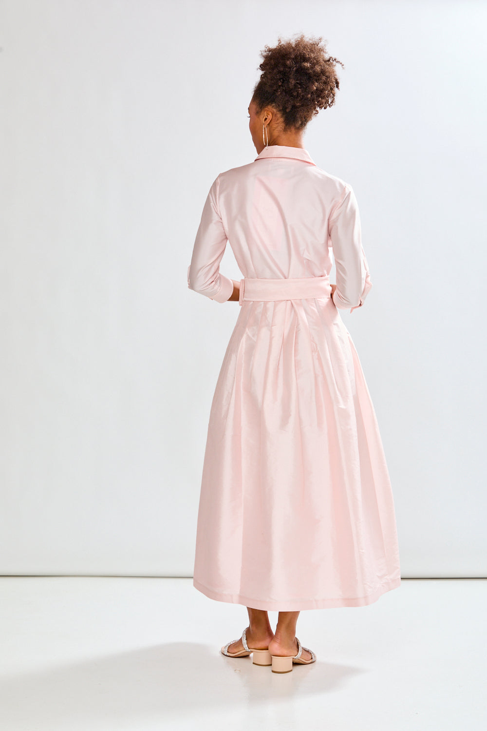 Woman in blush pink long taffeta dress