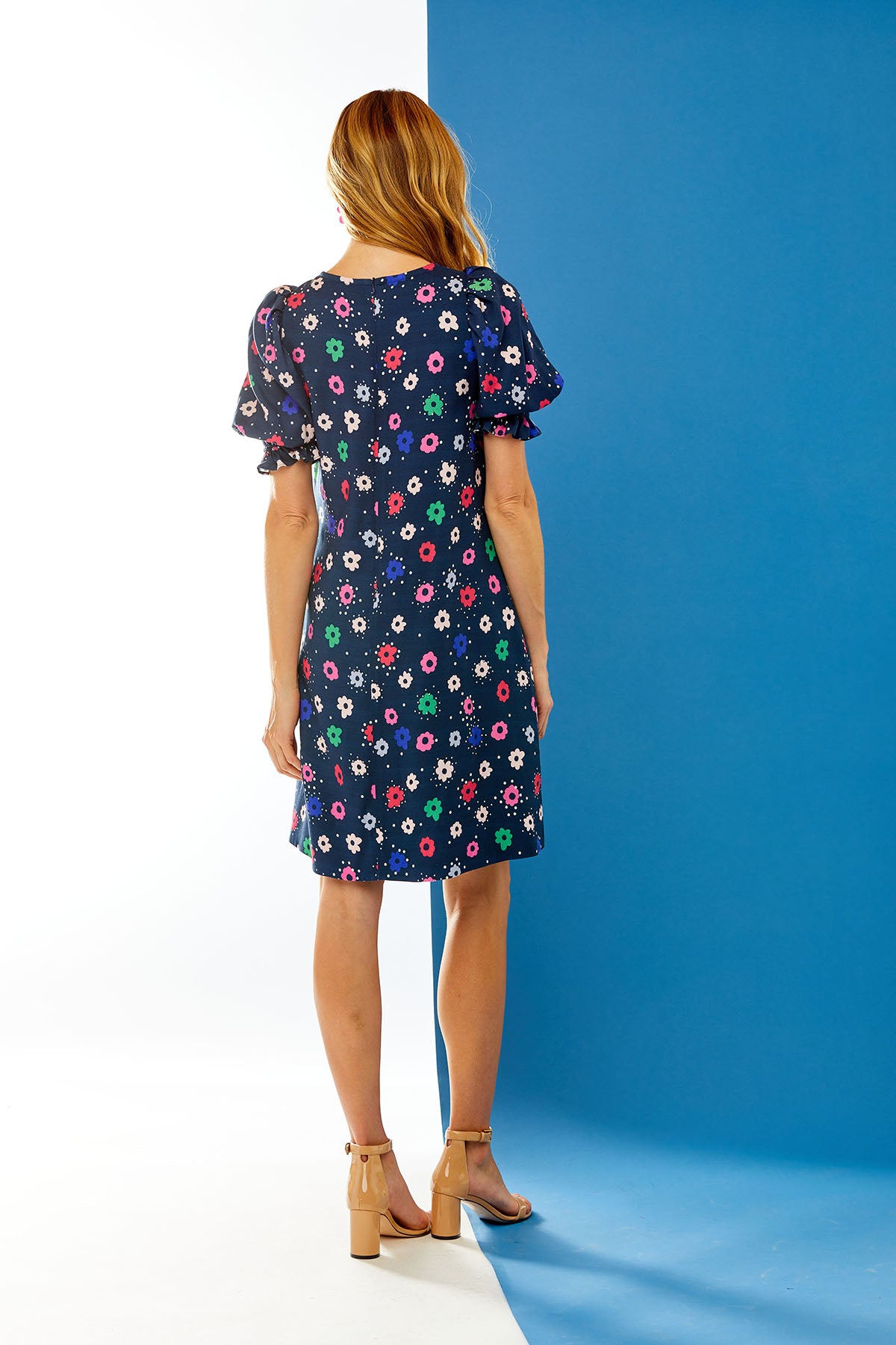 Woman in daisy print dress