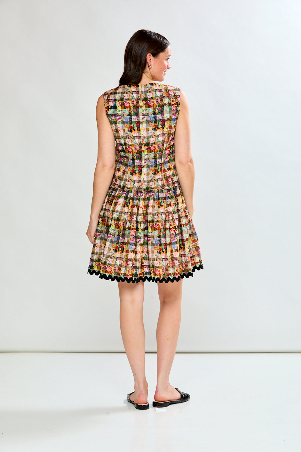 Woman in floral gingham dress