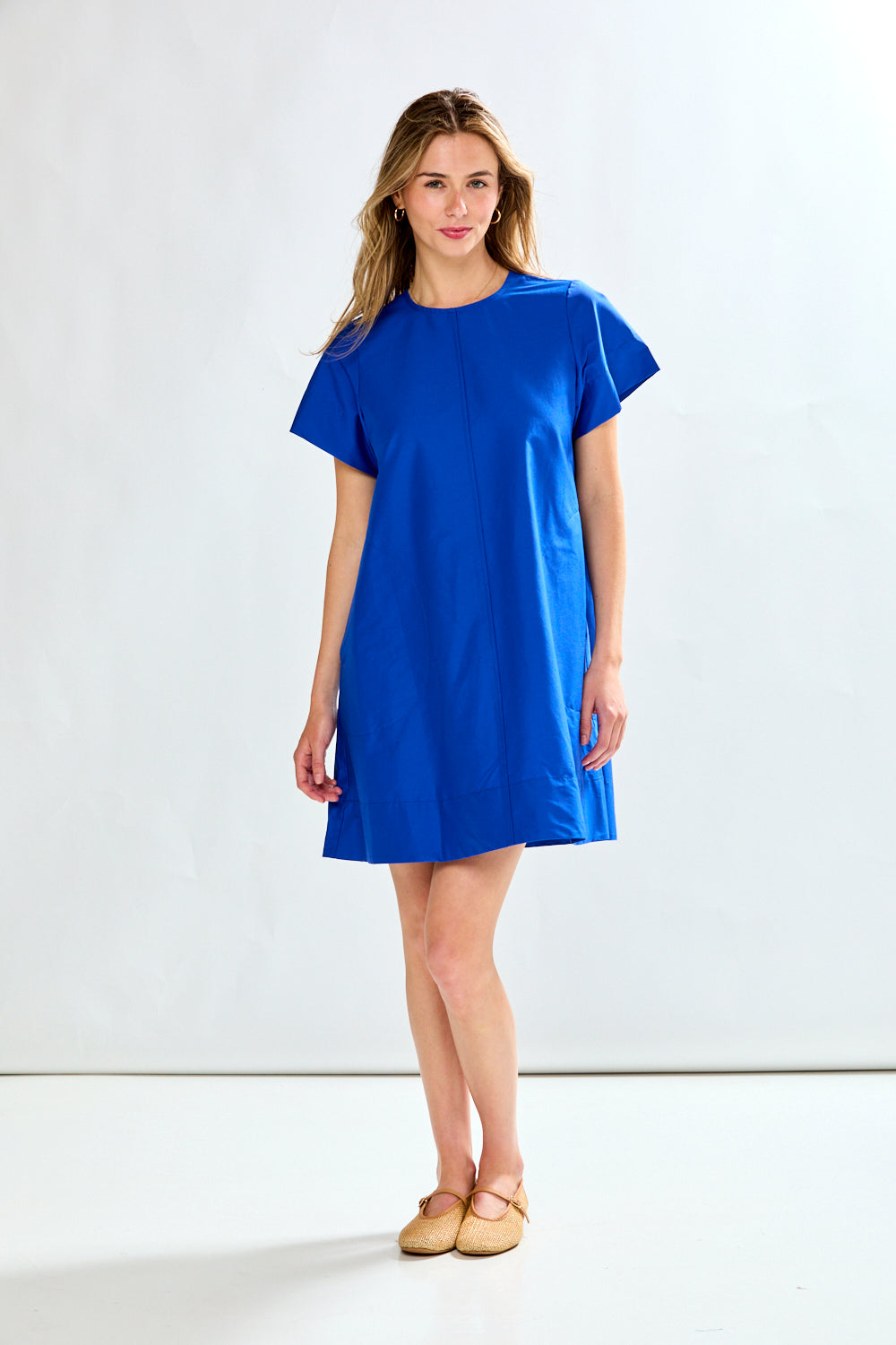 Woman in blue poplin short dress