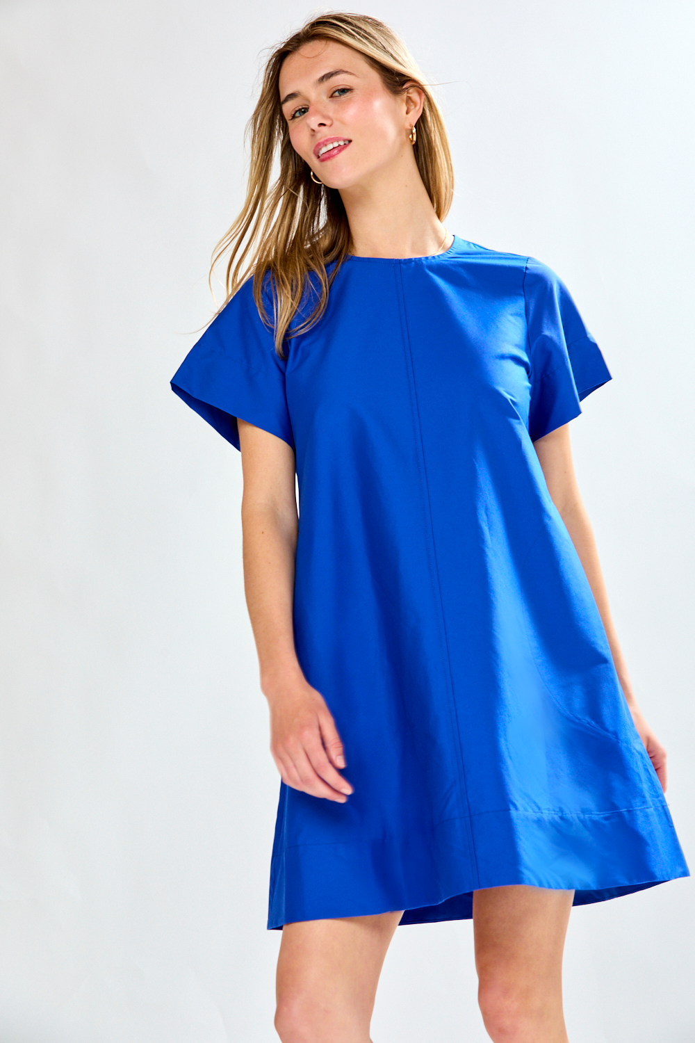Woman in blue poplin short dress