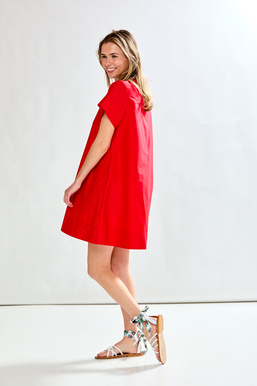 Woman in red poplin short dress