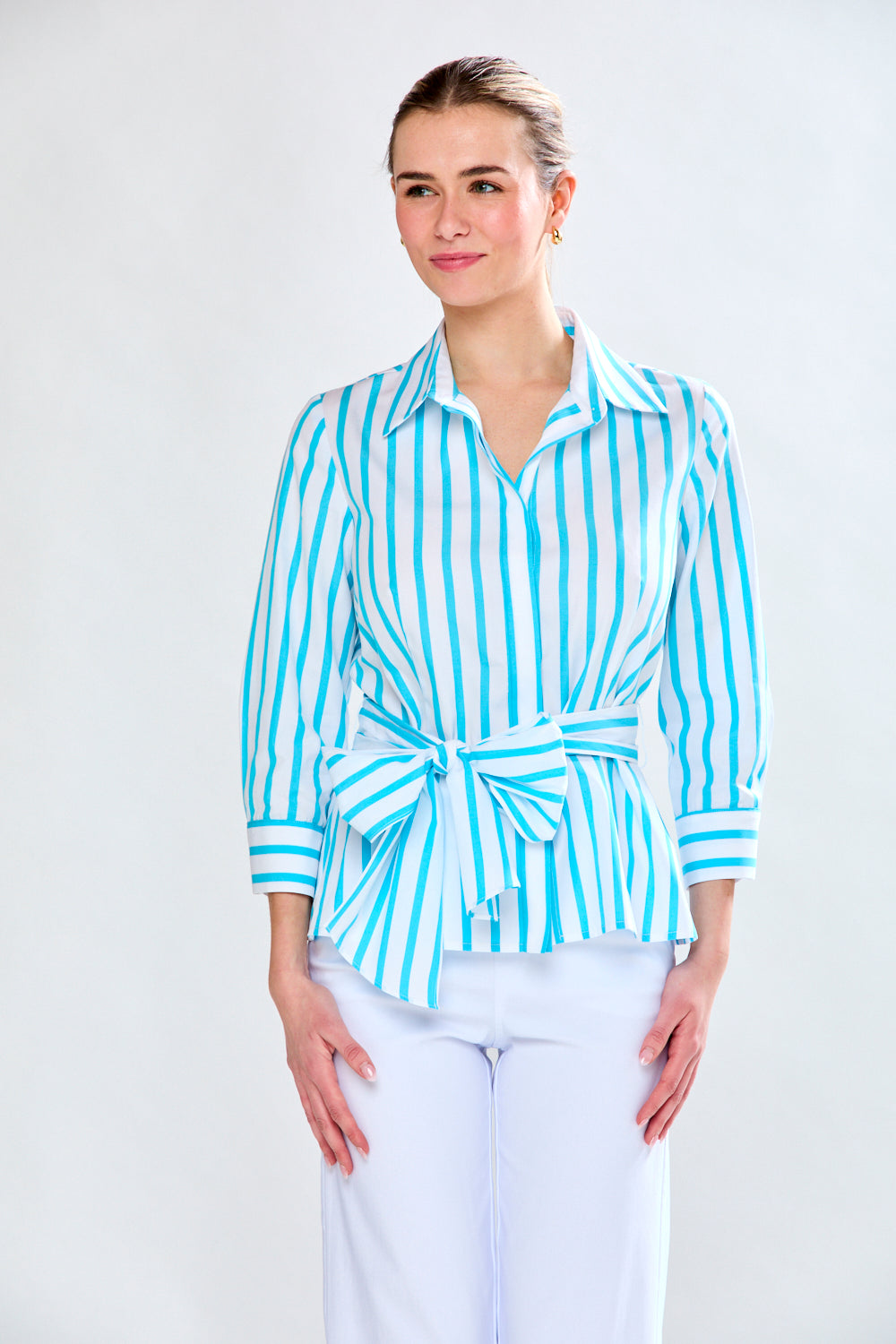 Woman in aqua and white stripe top
