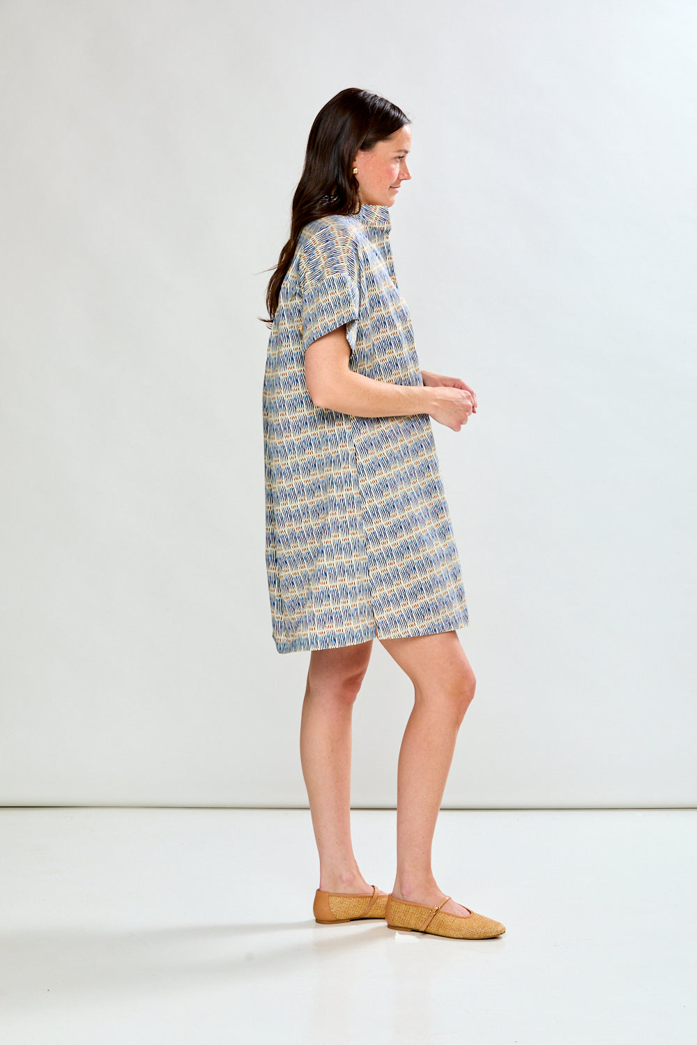 Woman in geo stripe dress