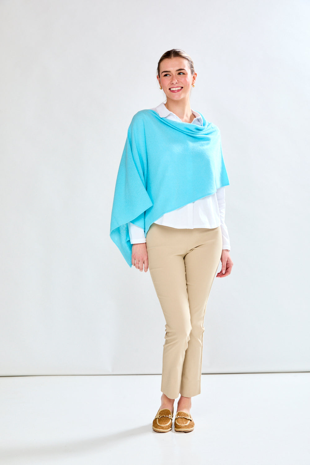 woman in light aqua wrap