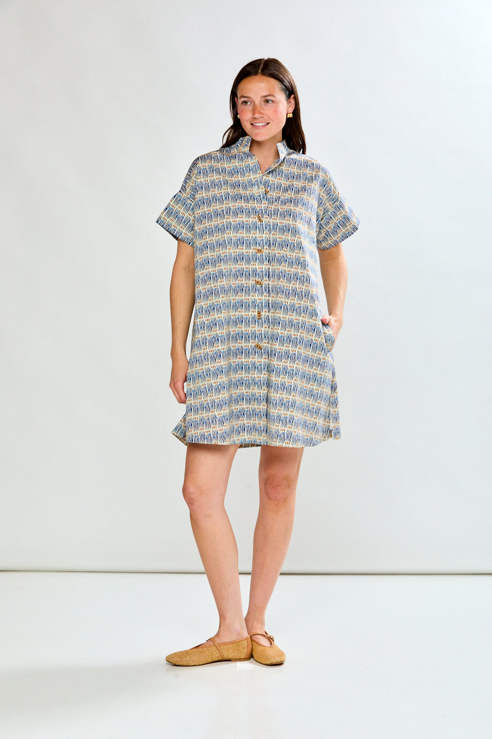 Woman in geo stripe dress