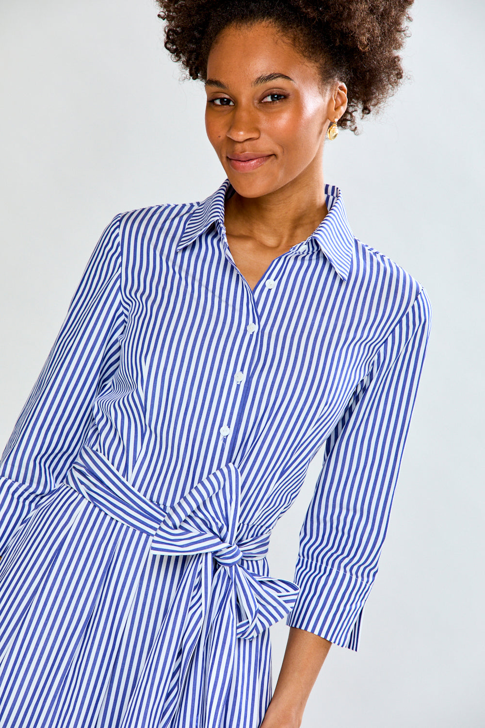 Woman in blue stripe dress