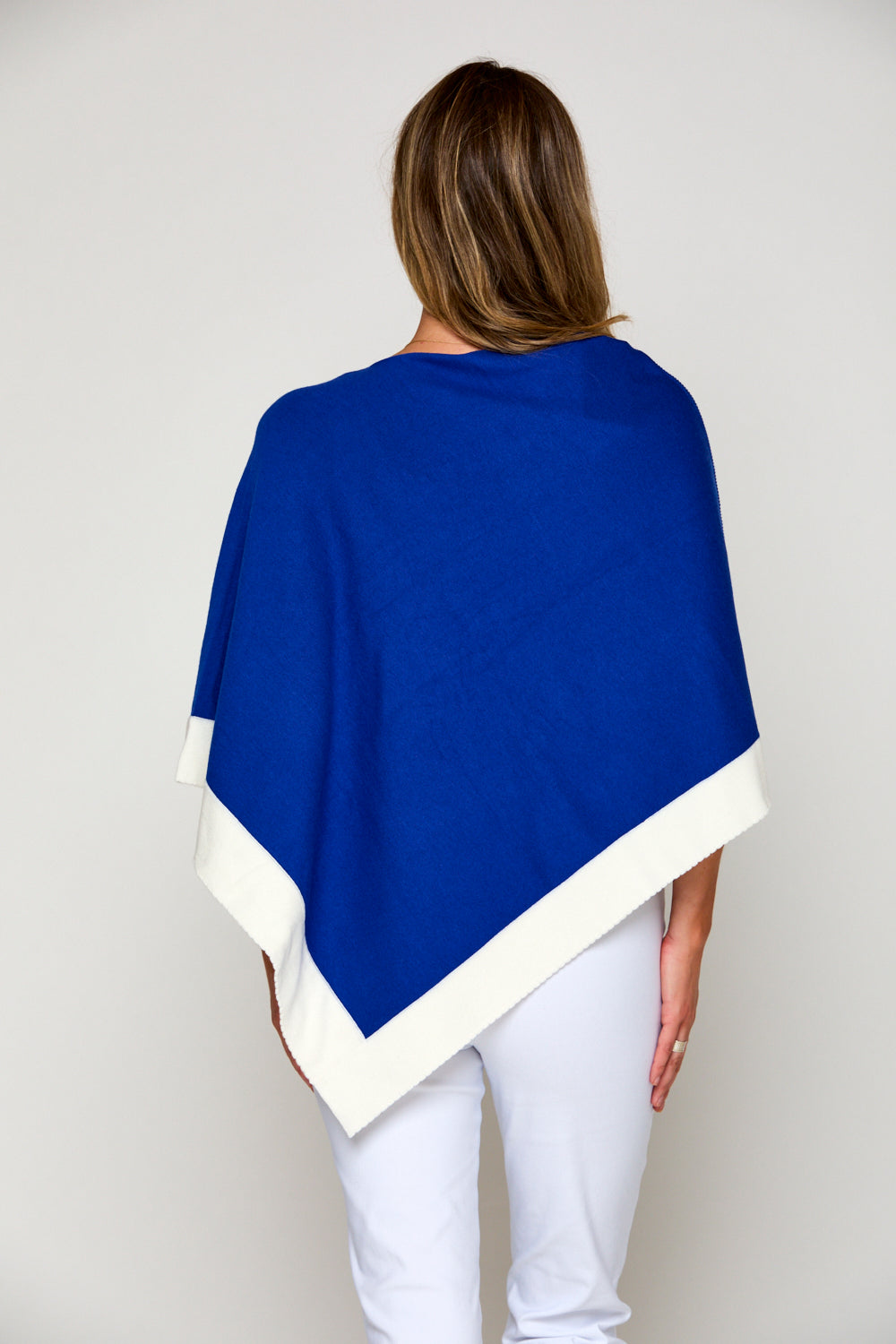 Woman in tipped poncho
