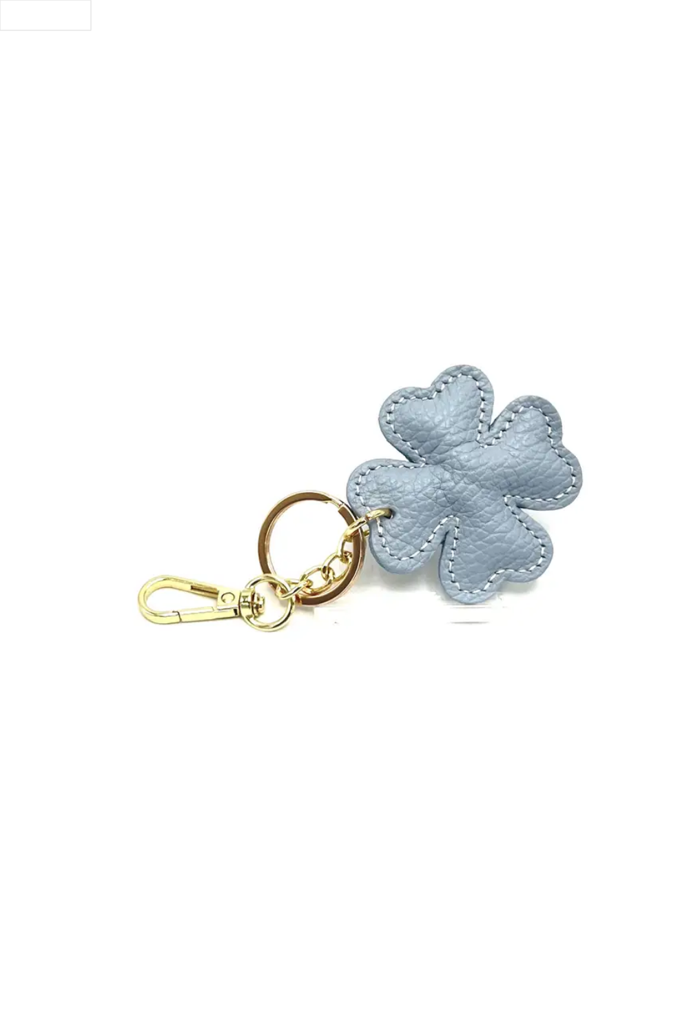 Light blue four-leaf clover keychain on a white background