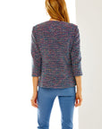 Woman in multi tweed jacket
