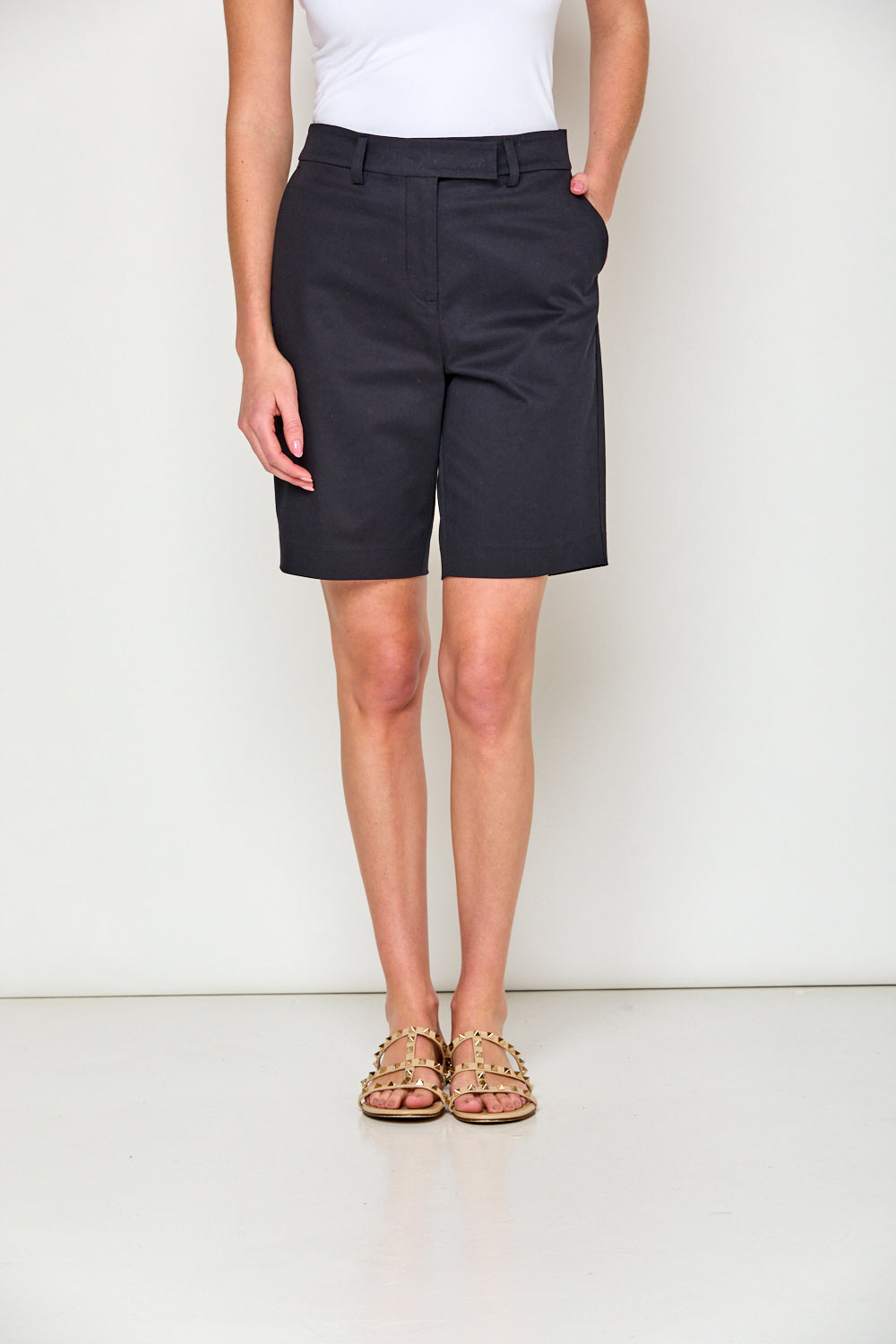 Woman in navy shorts