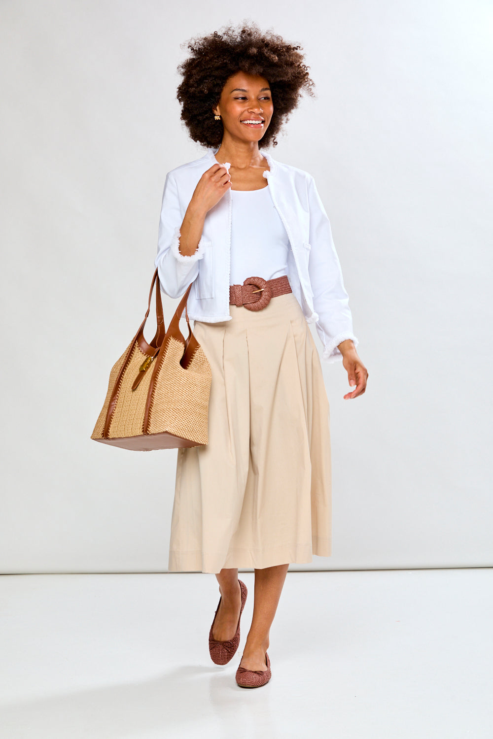 Woman in white fringe jacket