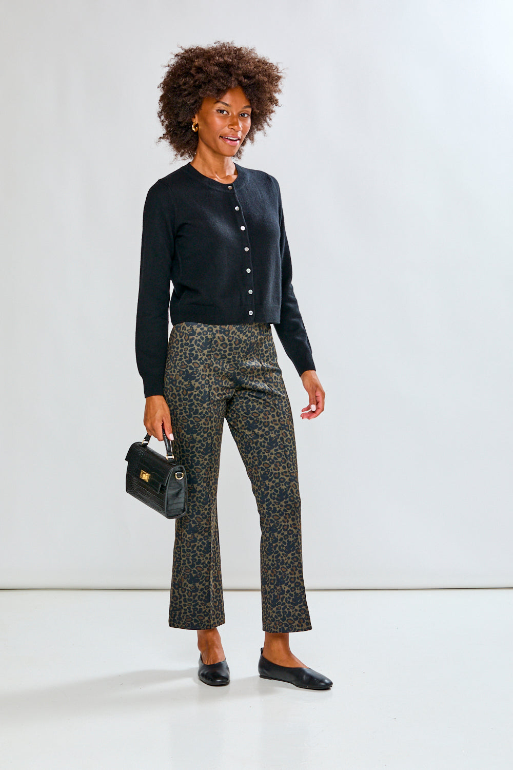 Woman in black cashmere sweater