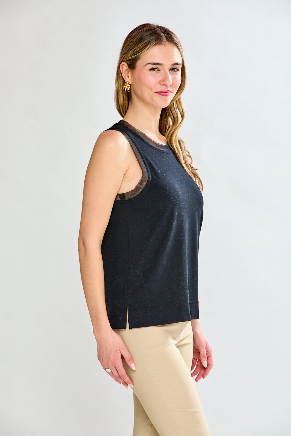 Woman in black sleeveless top