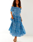 Woman in blue floral dress