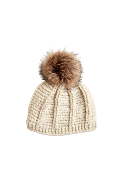 Beige knit beanie with a brown faux fur pom-pom on a white background