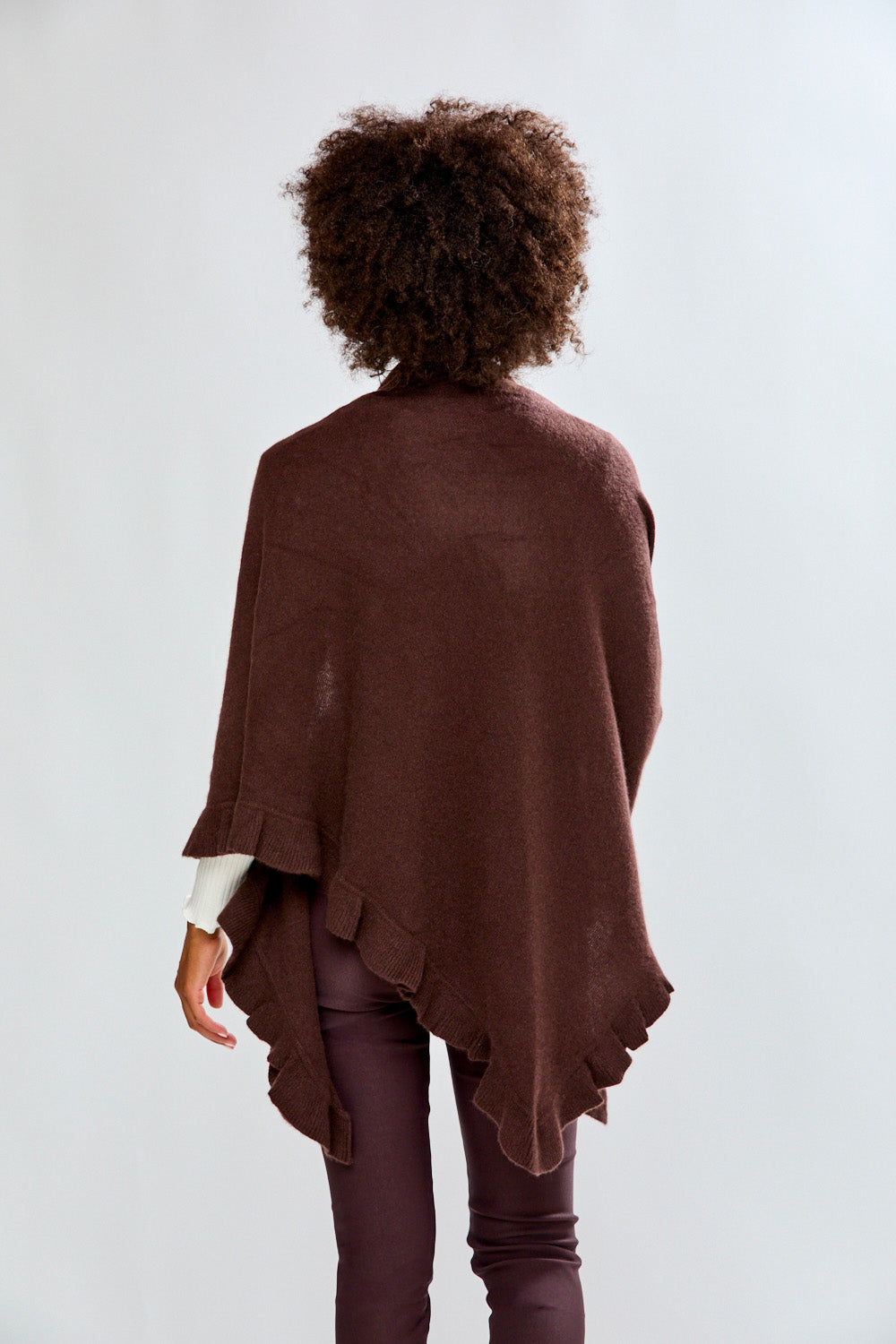 Woman wearing a espresso ruffle cashmere wrap