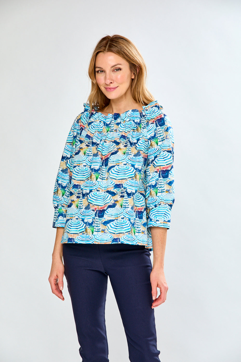woman in top with umbrellas on it