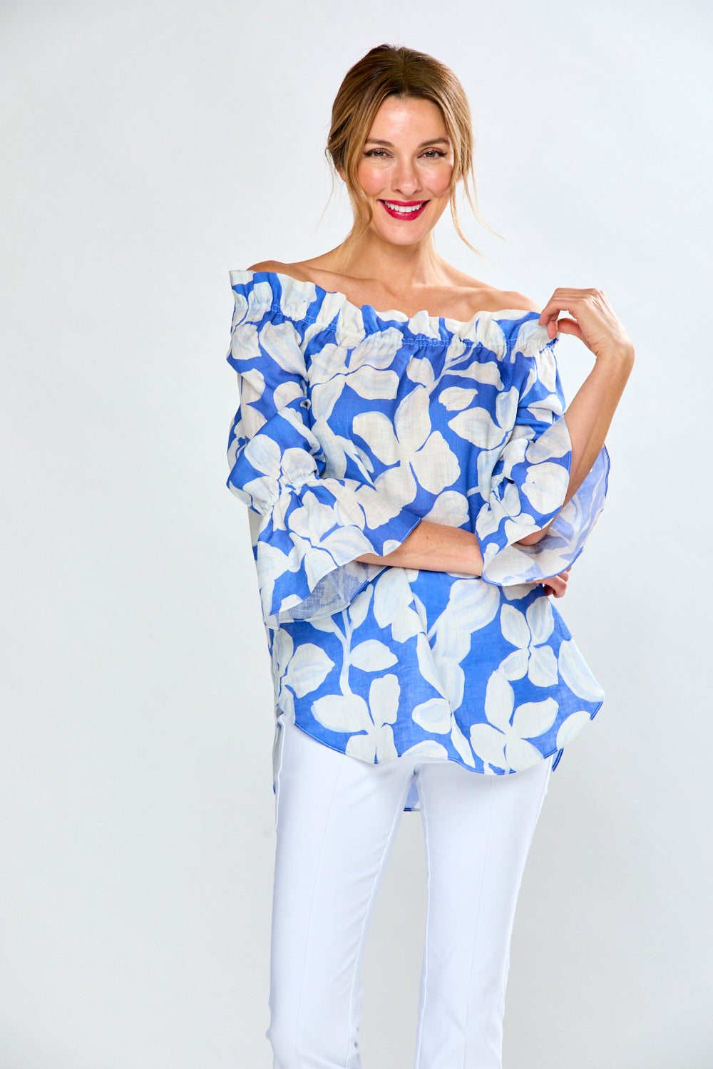 Woman in cobalt leaf print top