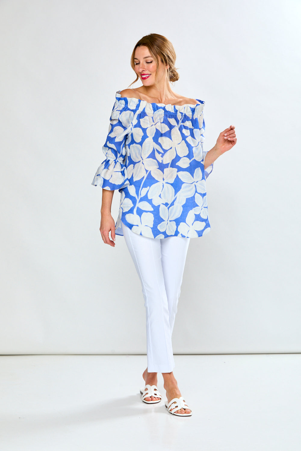 Woman in cobalt leaf print top