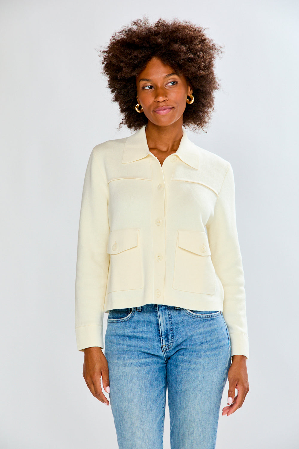 Woman in ivory sweater jacket