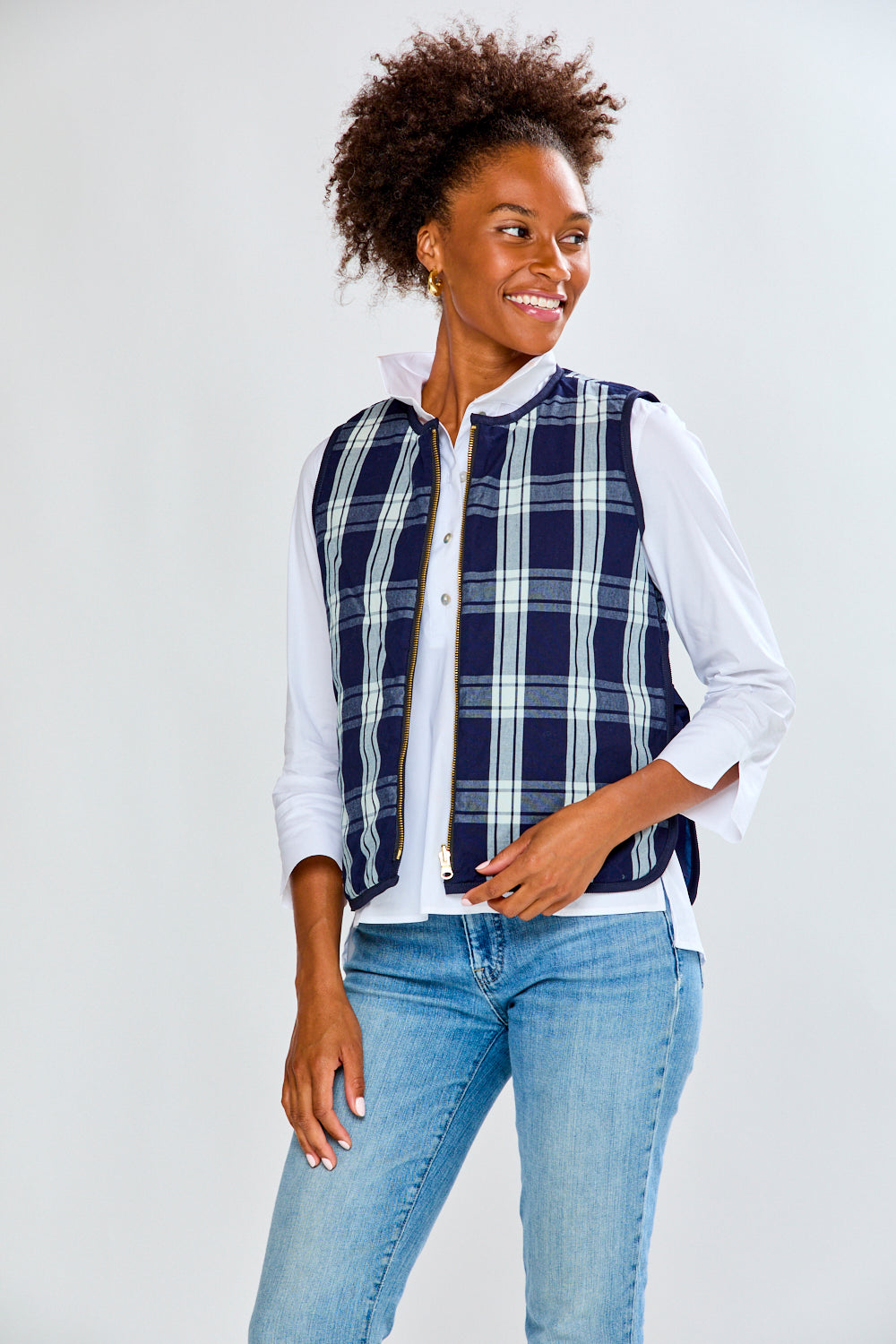 Woman in plaid quilted vest