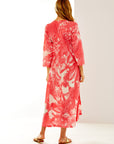 Woman in coral leaf tunic