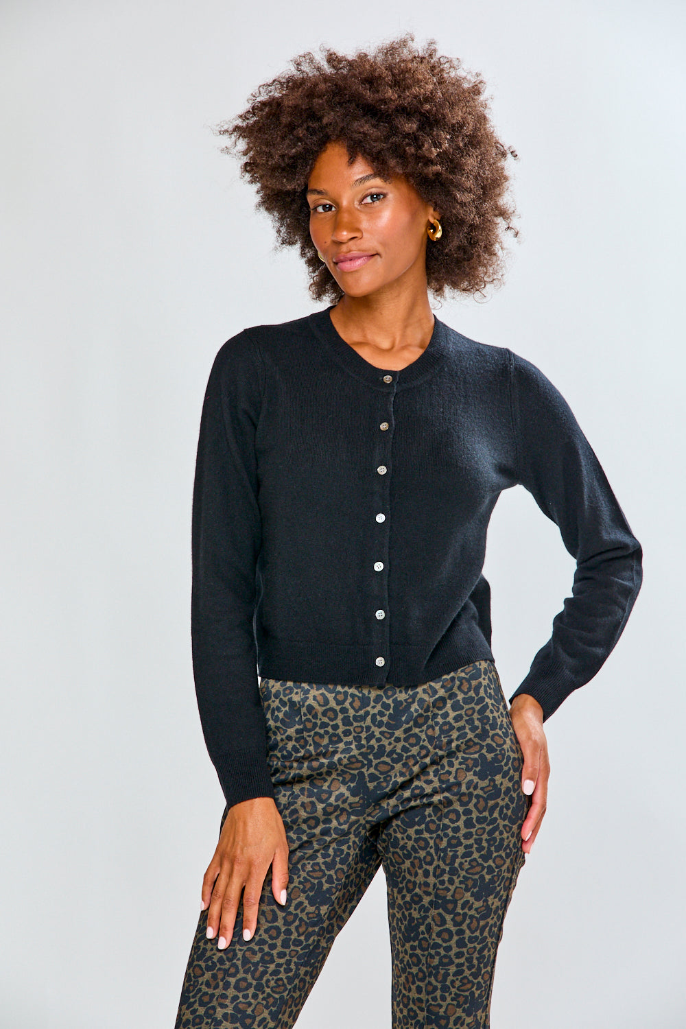 Woman in black cashmere sweater