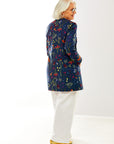 Woman in garden print jacket